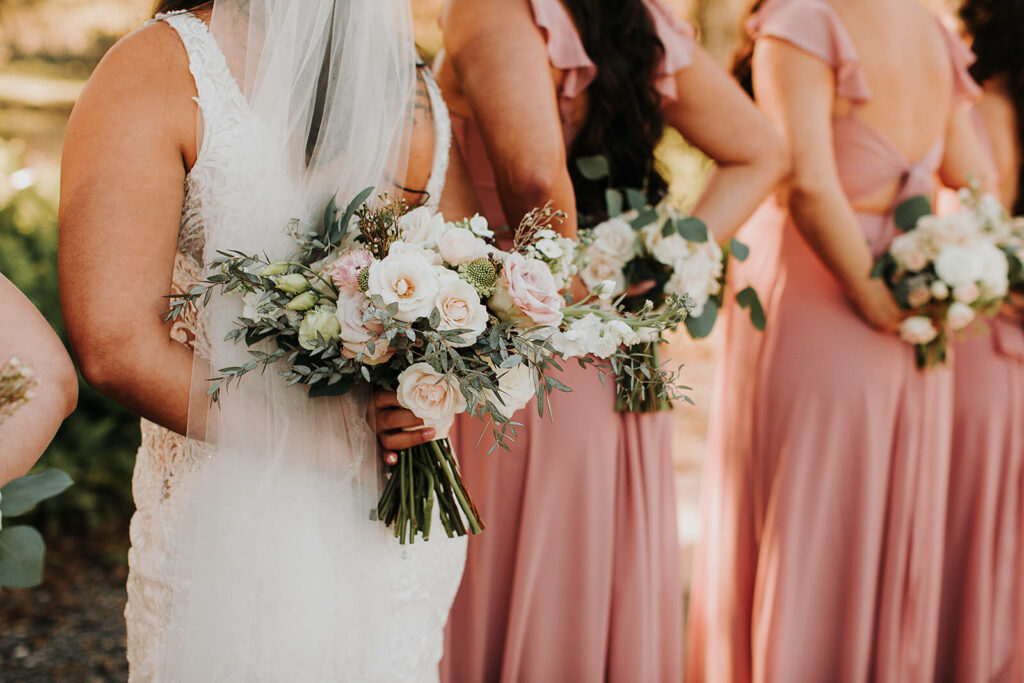 Bridal Party Holding Bouquets Behind Back