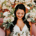 Bride Holding Bouquet Surrounded By Flowers