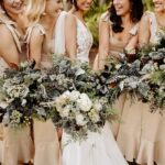 Bride and Bridesmaids Holding White and Blue Bouquets