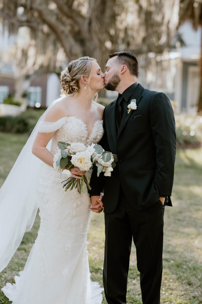 Bride and Groom Kiss The Highland Manor