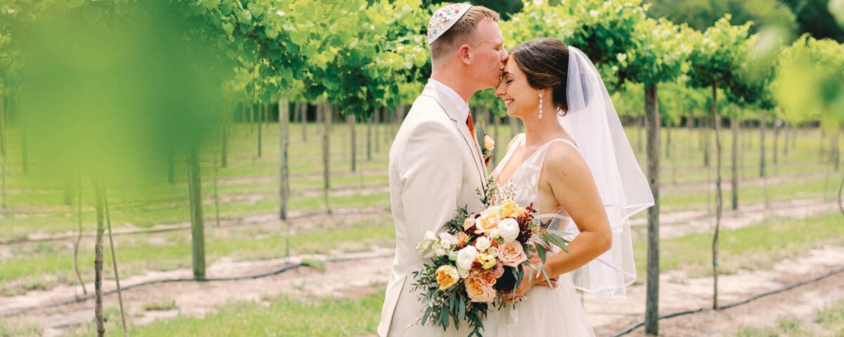 Groom Kissing Bride on Head